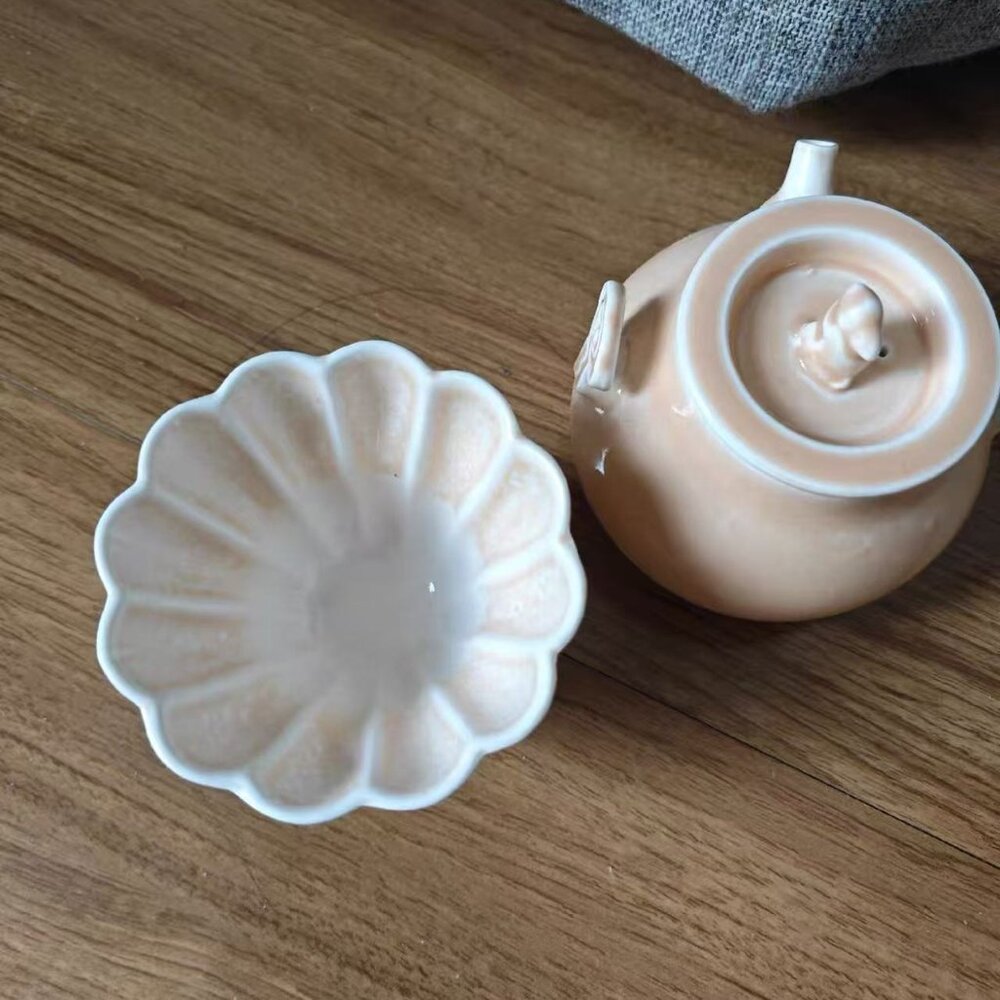 Simple ceramic cup with a matching sauce